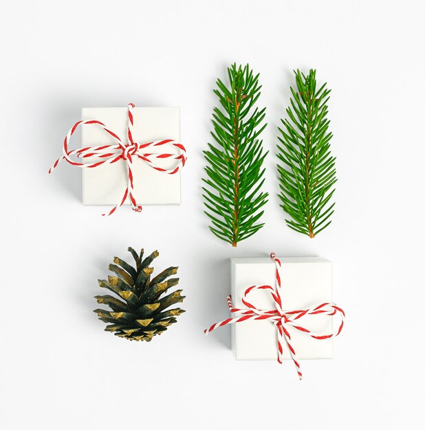 Christmas composition Christmas gift fi  branches on white background Flat lay top view