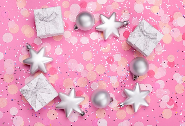 Christmas composition Christmas gifts and festive decoration on pink pastel background