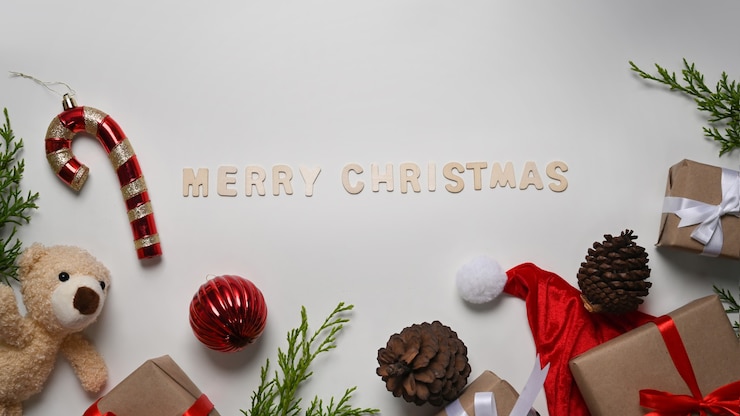 Photo christmas composition. christmas gifts and and red balls decorations on white background.