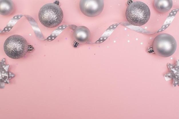 christmas composition christmas silver tree toys and christmas decorati at the pink background
