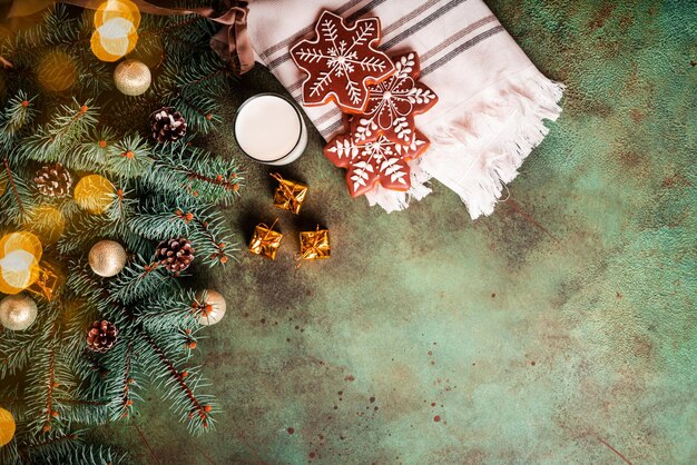 Premium Photo  Christmas baking. fir trees with decoration, flour, spices  and cookies molds on a cutting board. beautiful cookies with decor on green  surface