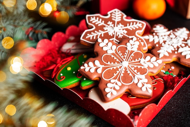 Christmas composition. A Christmas tree decorated with toys and a garland and gingerbreads. High quality photo