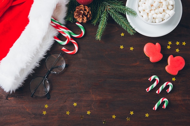 Christmas composition on dark background with candy