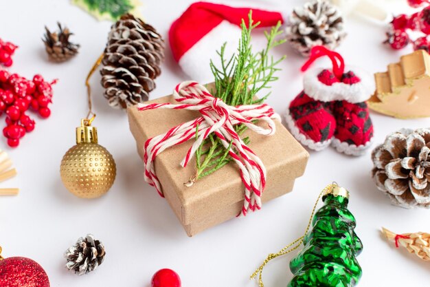 Christmas composition flatlay Christmas gifts red and gold fir branches and red berries