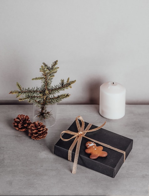 Christmas composition Gift black and golden decorations on grey stone background