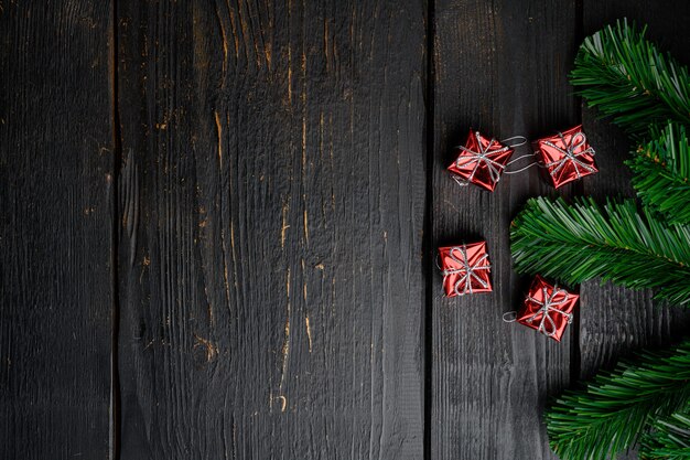 Christmas composition for gift postcard set, top view flat lay, on black wooden table background, with copy space for text