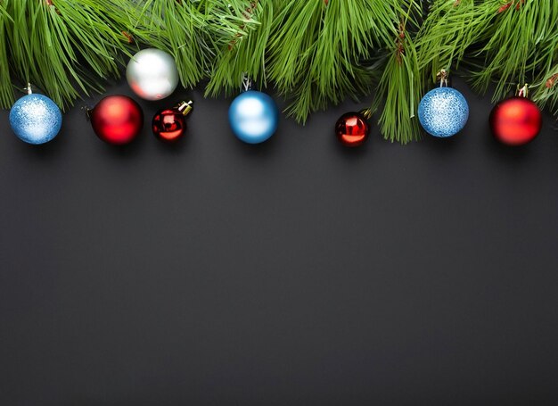 christmas composition of green fir tree branches with red baubles High quality and resolution beautiful photo concept