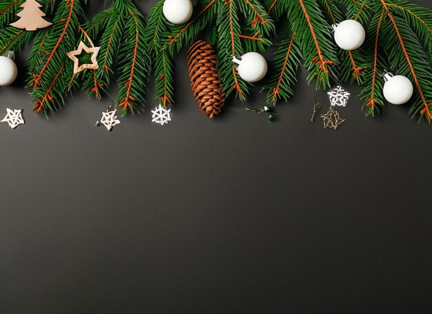 christmas composition of green fir tree branches with red baubles High quality and resolution beautiful photo concept