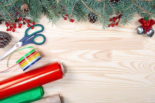 Christmas composition made of fir tree branches, present gift on white table.