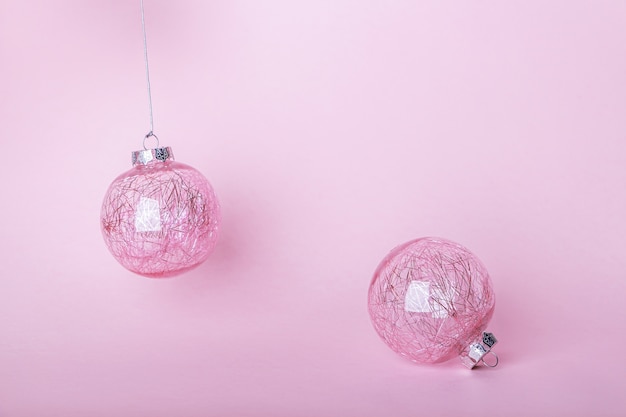 Christmas composition. pink bauble, shiny balls hanging