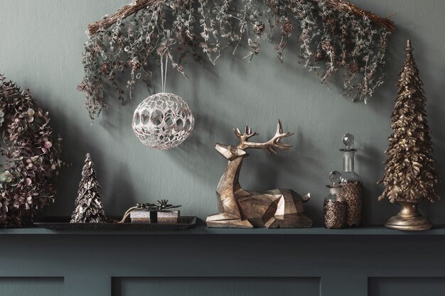 Christmas composition on the shelf in the living room interior. Beautiful decoration. Christmas trees, candles, stars, light and elegant accessories. Merry Christmas and Happy Holidays, Template.