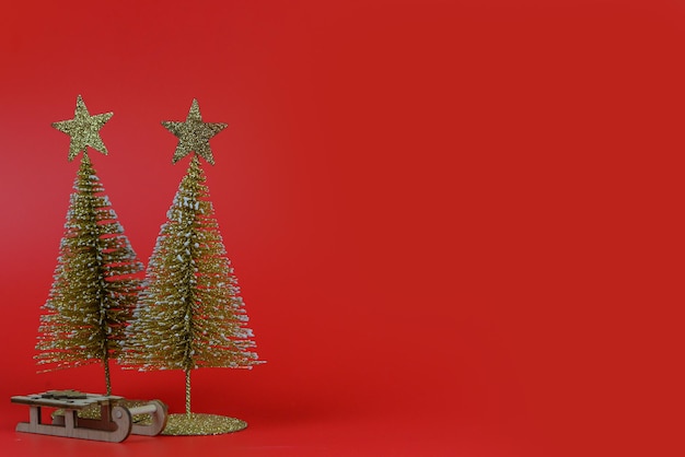 Christmas composition small Christmas tree on a red background New Year concept