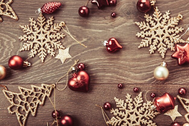 Christmas composition. Spruce branches, xmas tree, xmas pink decor holiday ball with ribbon on white background.