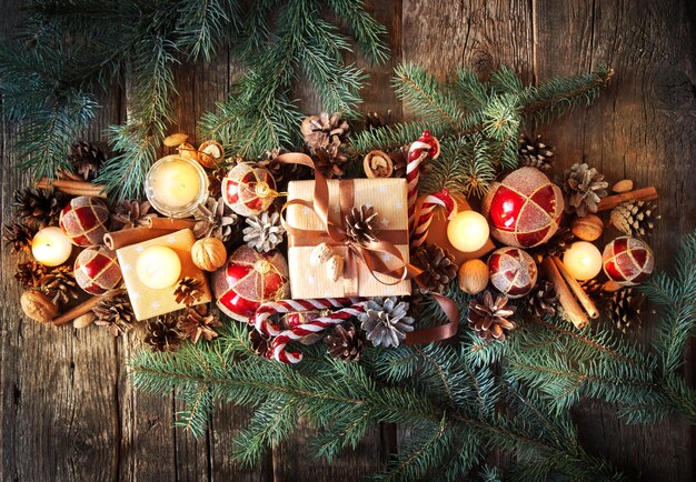 Christmas Composition Top View. Fir Tree Toys with Burning Candles and Spruce 