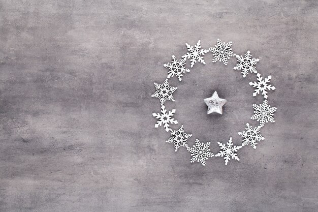 Photo christmas composition. white snow flakes wreath decorations