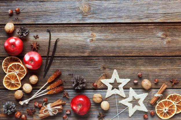 Christmas composition with apples, walnuts, cinnamon for celebration of Christmas 