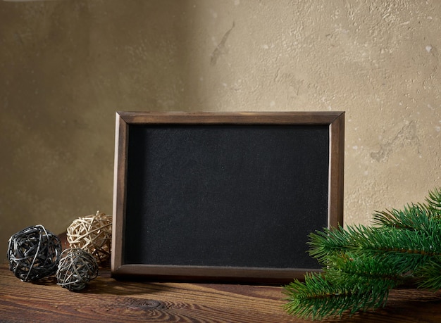 Christmas composition with blackboard and decorations