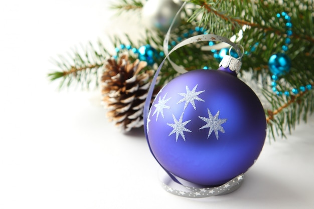 Christmas composition with blue ball and decoration over white