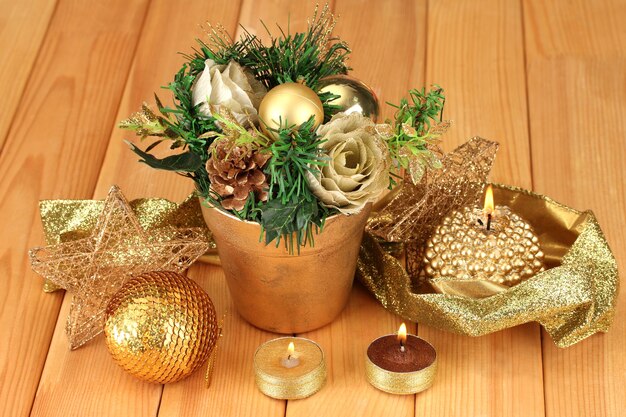 Christmas composition  with candles and decorations on wooden background