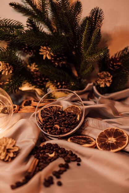 Christmas composition with coffee beans dried oranges and garland