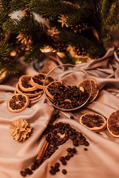 Christmas composition with coffee beans and dried oranges