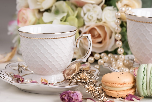 Christmas composition with flowers and white tea cups