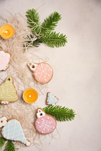 Christmas composition with ginger cookies candles and spruce branches