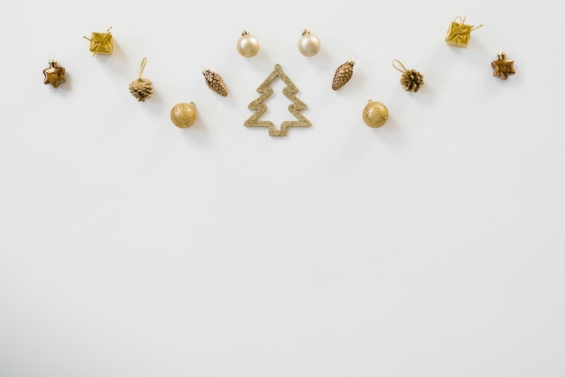 Christmas composition with gold Christmas toys, balls and cones