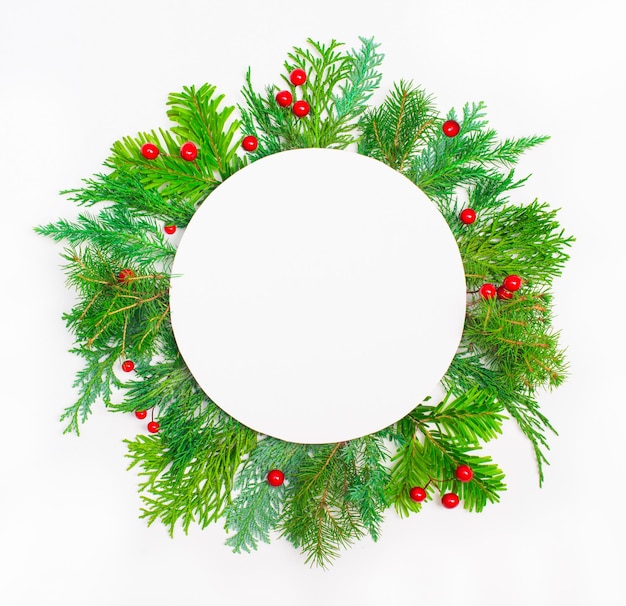 Christmas composition with round copy space Christmas fir branches on white background Flat lay