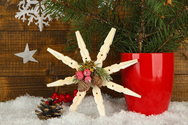 Christmas composition with snowflakes on wooden background