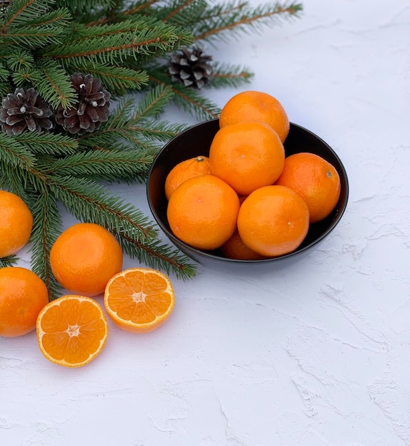 Christmas composition with tangerines on white background. Space for text