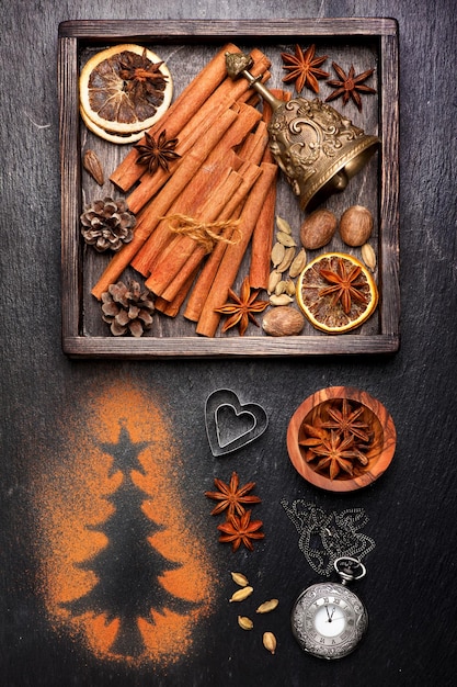 Christmas composition with Vintage christmas decoration and spices for baking