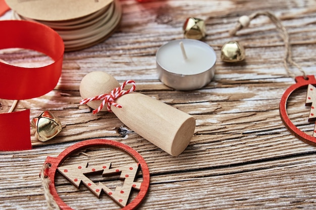 Christmas composition withhandmade toys on wooden background flat lay