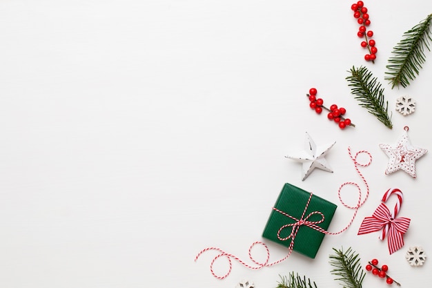 Christmas composition. Wooden decorations, stars on white background. 