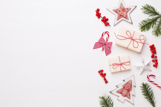 Christmas composition. Wooden decorations, stars on white background. 