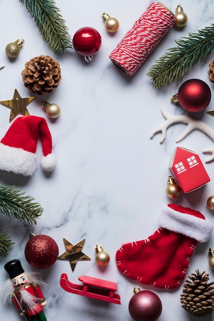 Christmas compostion baubles santa hat christmas tree on a marble background