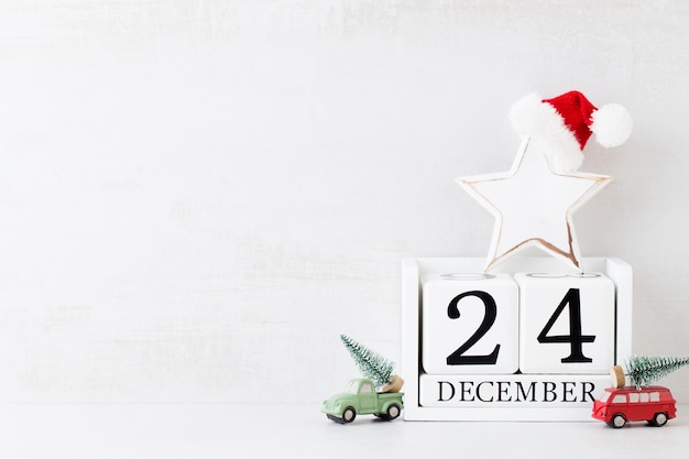 Christmas concept backgrounds. Christmas calendar, 24 december on the gray background.