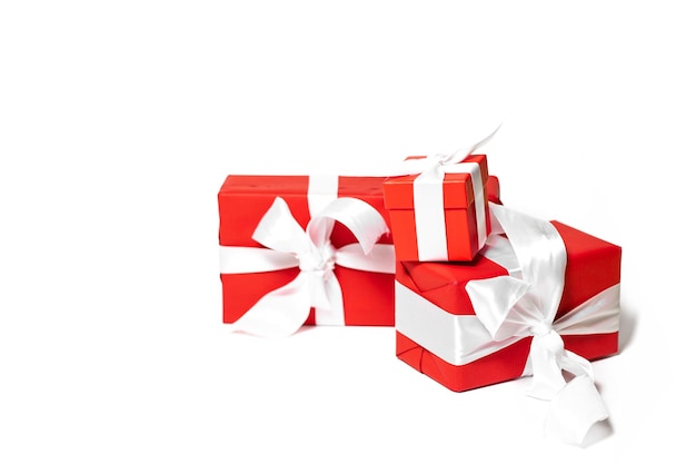 Christmas concept. Christmas gifts wrapped in red paper on a white isolated background.