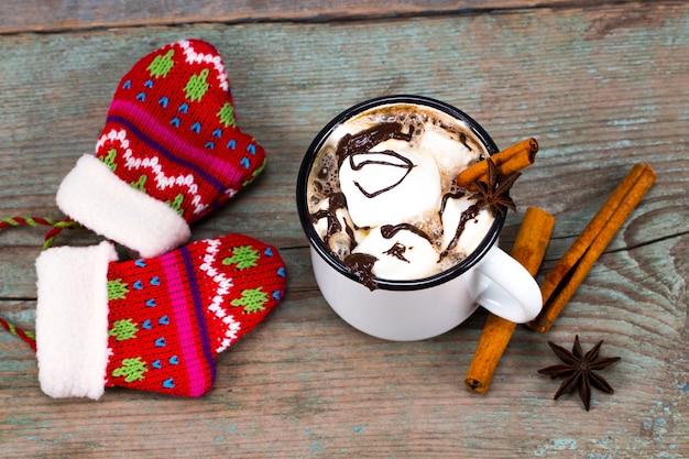 Christmas concept, hot chocolate or cocoa with marshmallows and spices.