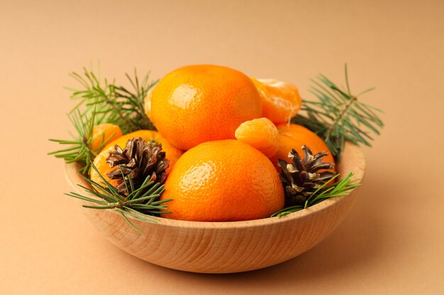 Christmas concept with mandarins on beige background