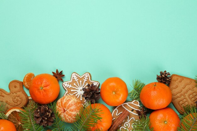 Photo christmas concept with mandarins on mint background