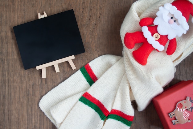 Photo christmas concept with winter and celebration items on wooden background