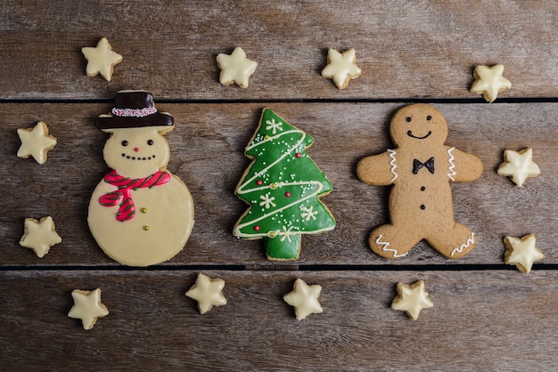 Photo christmas cookie, new year shape of christmas tree, gingerbread man, snowman, snowflake, o