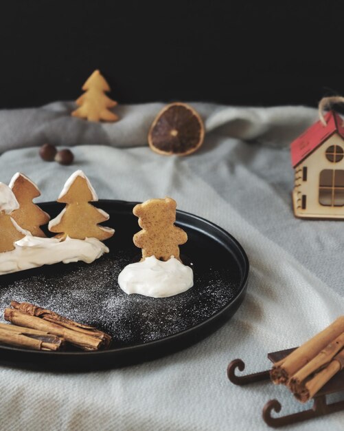 christmas cookies on black plate