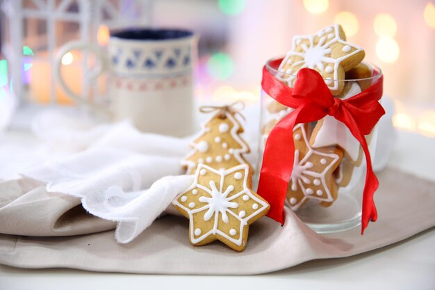 Christmas cookies and cup of tea, on table at home