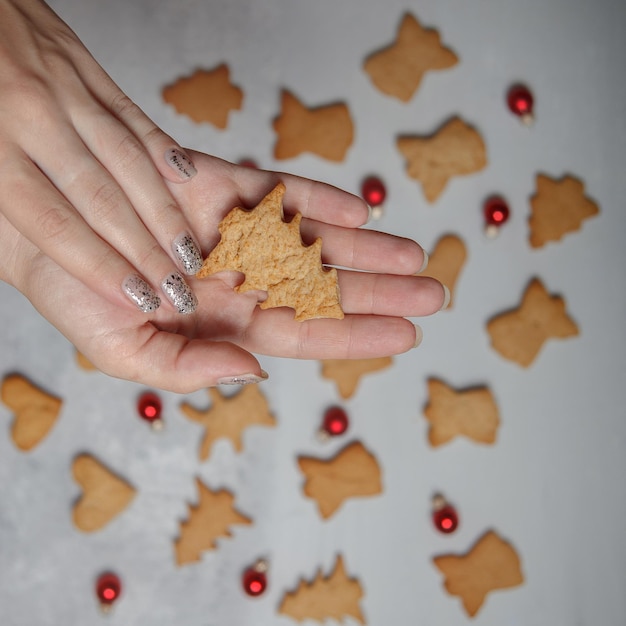 Christmas cookies in the form of figurines on the palm
