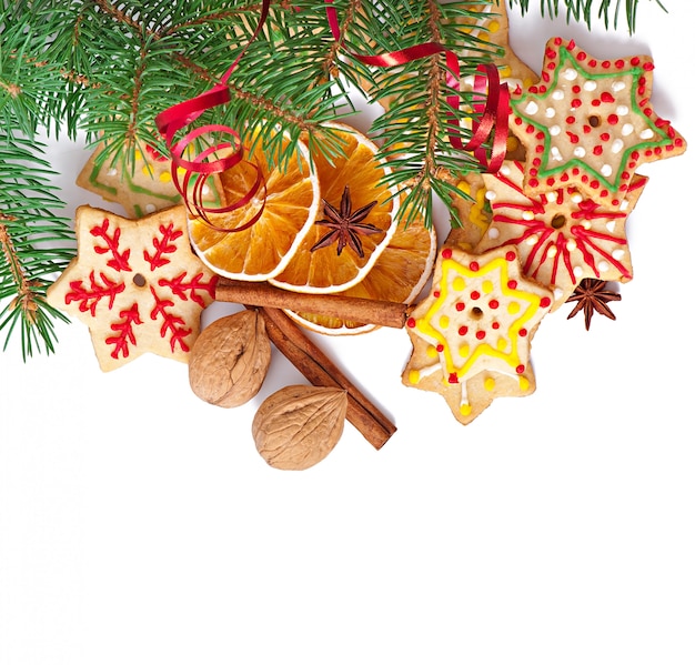 Christmas cookies, spices and spruce branches isolated on white background