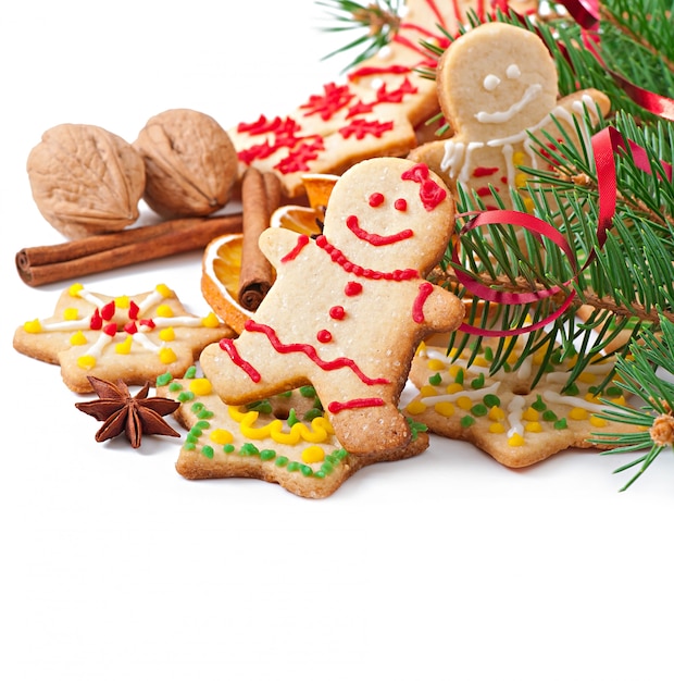 Christmas cookies, spices and spruce branches isolated on white background