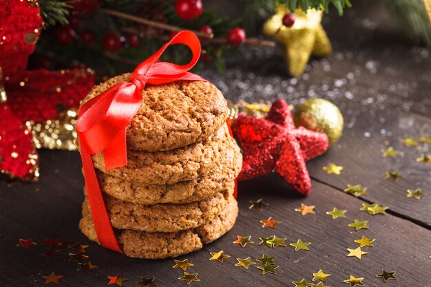 Christmas cookies on the table with red ribbon