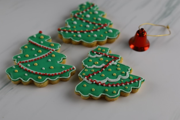 Christmas cookies with Christmas tree shape served in white plate with white background